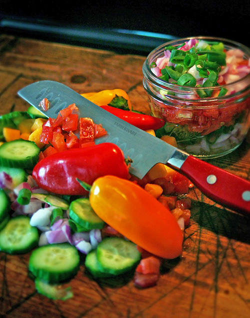 Various veggies and a kitchen knife advertising gardening gifts for Mother's day
