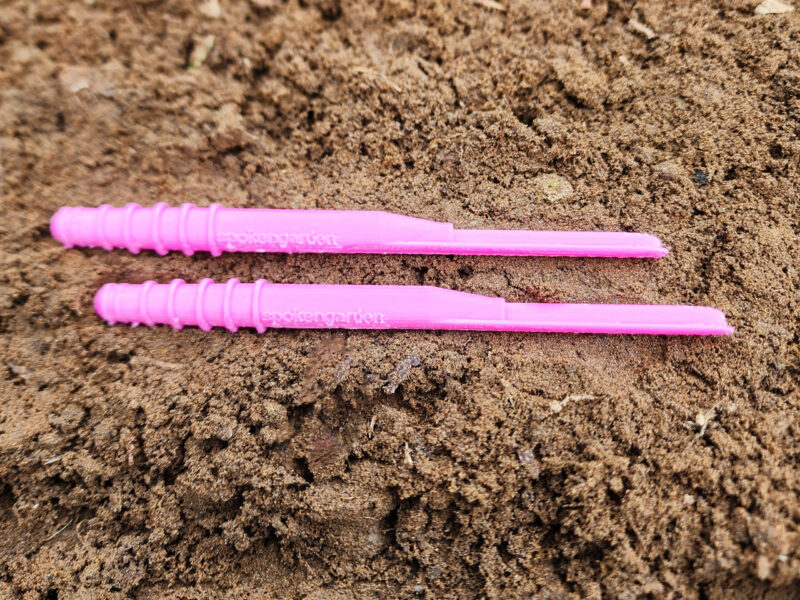 Pink Dibby XL Double Pack in garden soil laying next to each other.